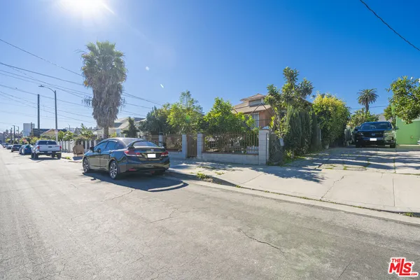 a view of street with parked cars