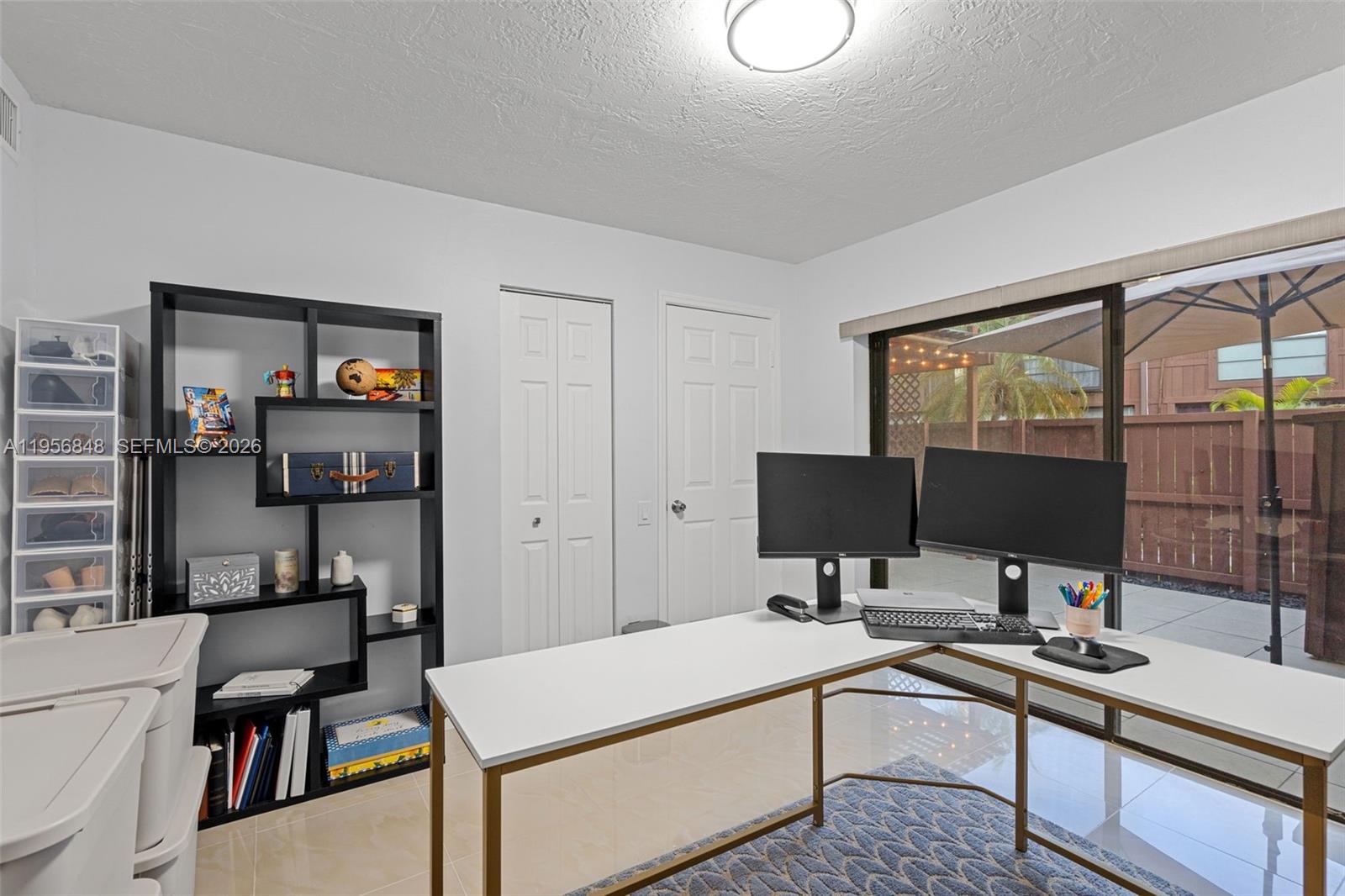 6554 Southwest 114th Place, Unit E74 Miami, FL 33173 - Photo 16 of 51 This bedroom downstairs has sliding doors that open to the front patio. Its natural light is so energizing!