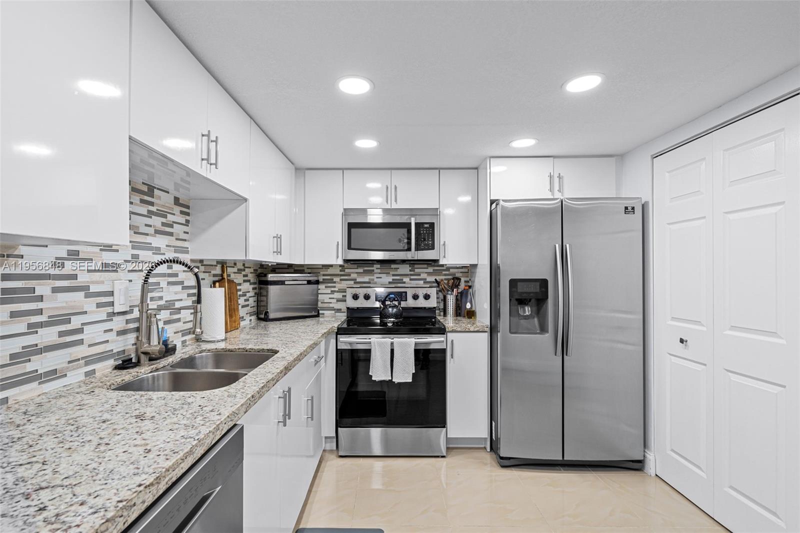 6554 Southwest 114th Place, Unit E74 Miami, FL 33173 - Photo 22 of 51 View 2 of 3 of of the kitchen