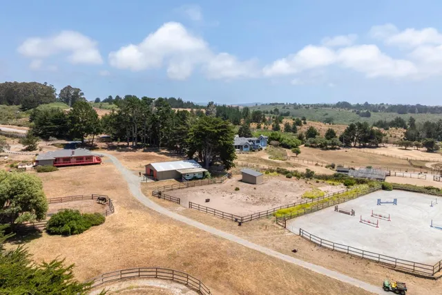 a view of living room kitchen with furniture and large window