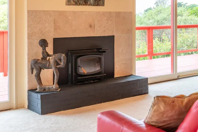 a kitchen with stainless steel appliances a refrigerator a sink dishwasher a oven with white cabinets and wooden floor