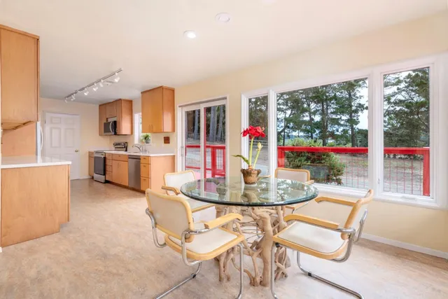 a spacious bedroom with a bed and a window