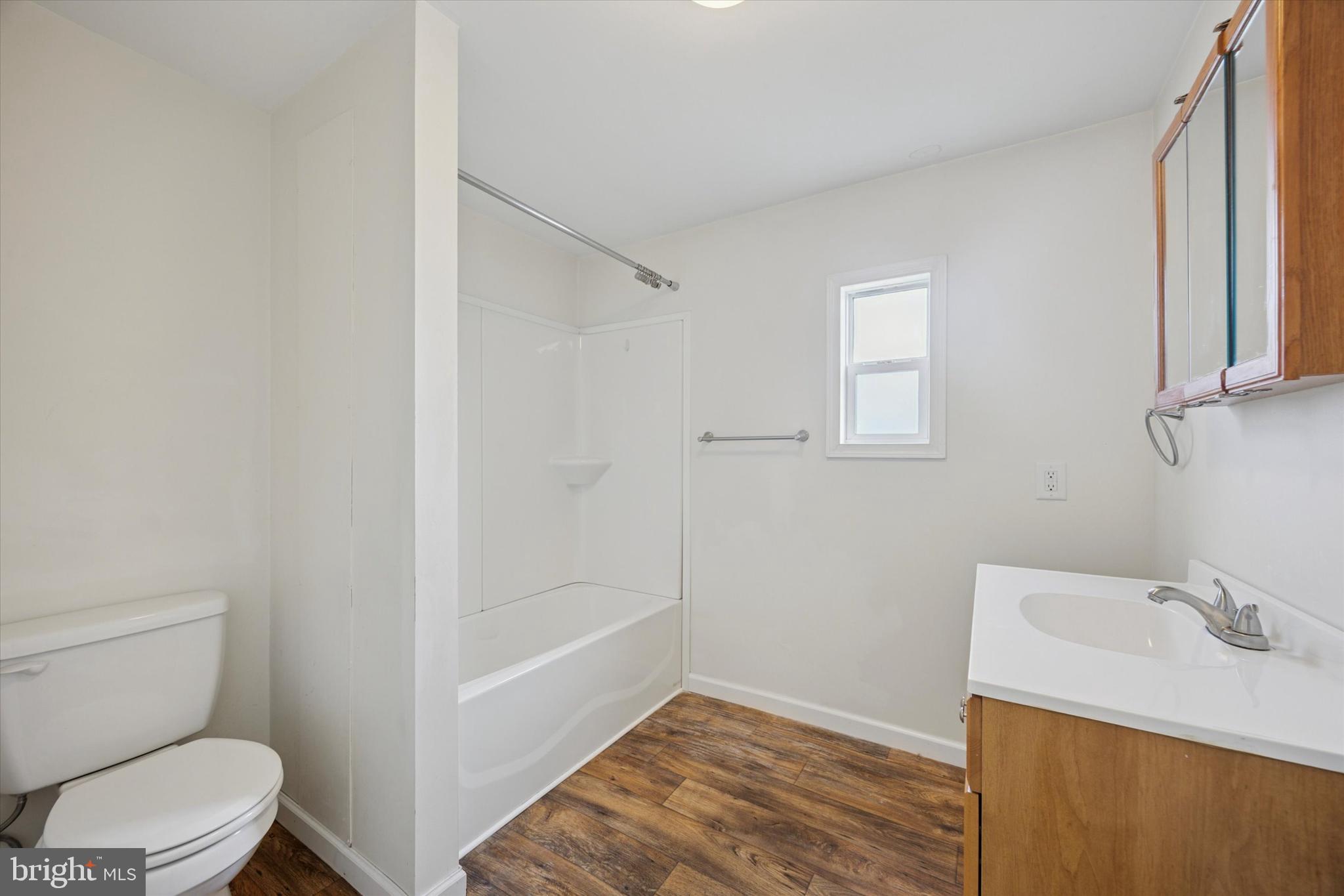 326 Delta Road Wilmington, DE 19810 - Photo 12 of 17 a bathroom with a sink a toilet and shower