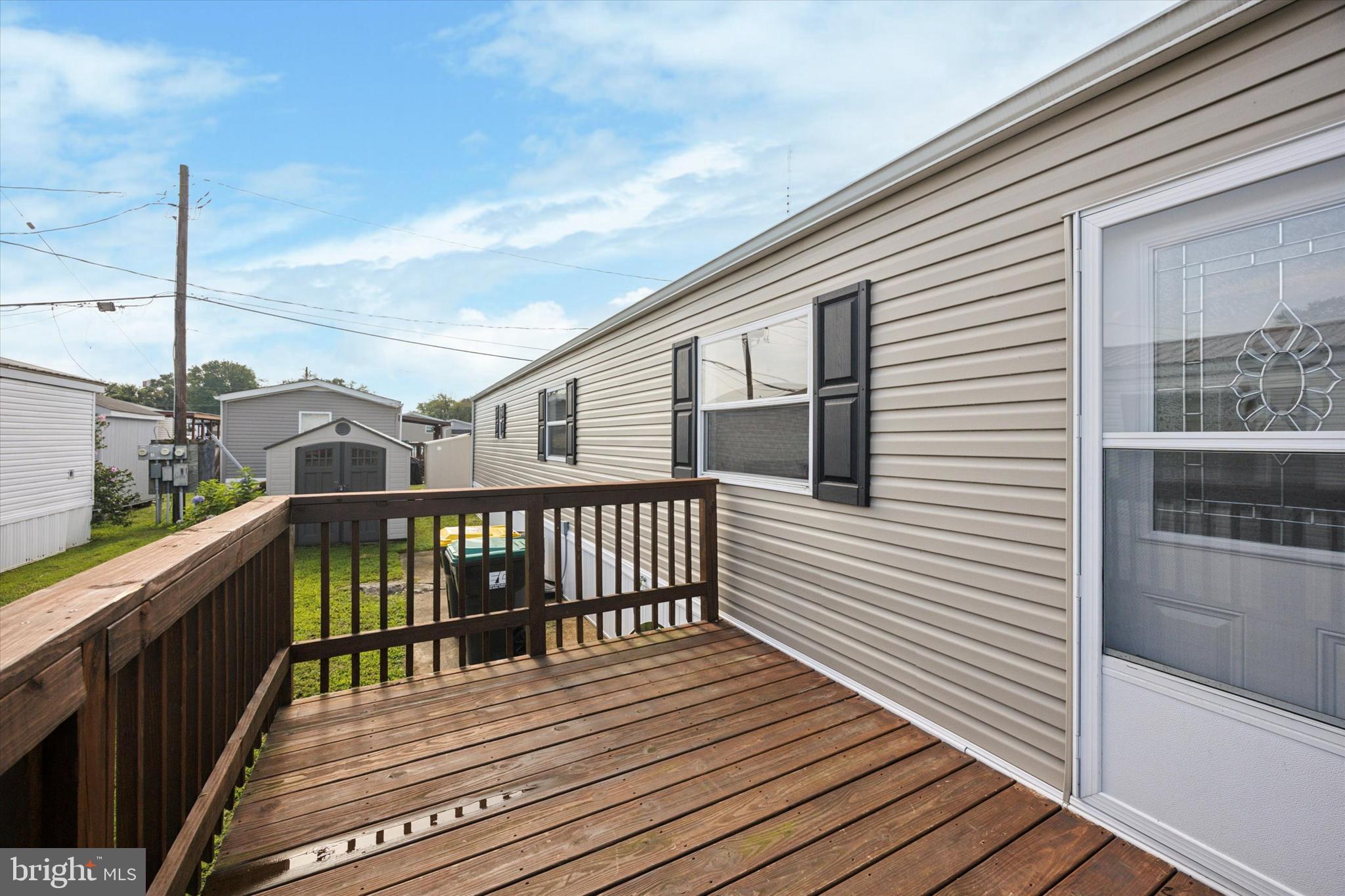 326 Delta Road Wilmington, DE 19810 - Photo 3 of 17 a view of a balcony with wooden floor