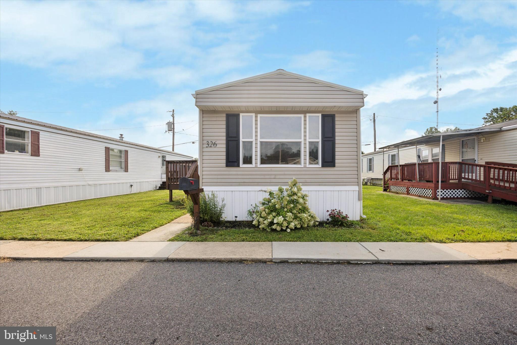 326 Delta Road Wilmington, DE 19810 - Photo 4 of 17 a front view of a house with a yard and garage