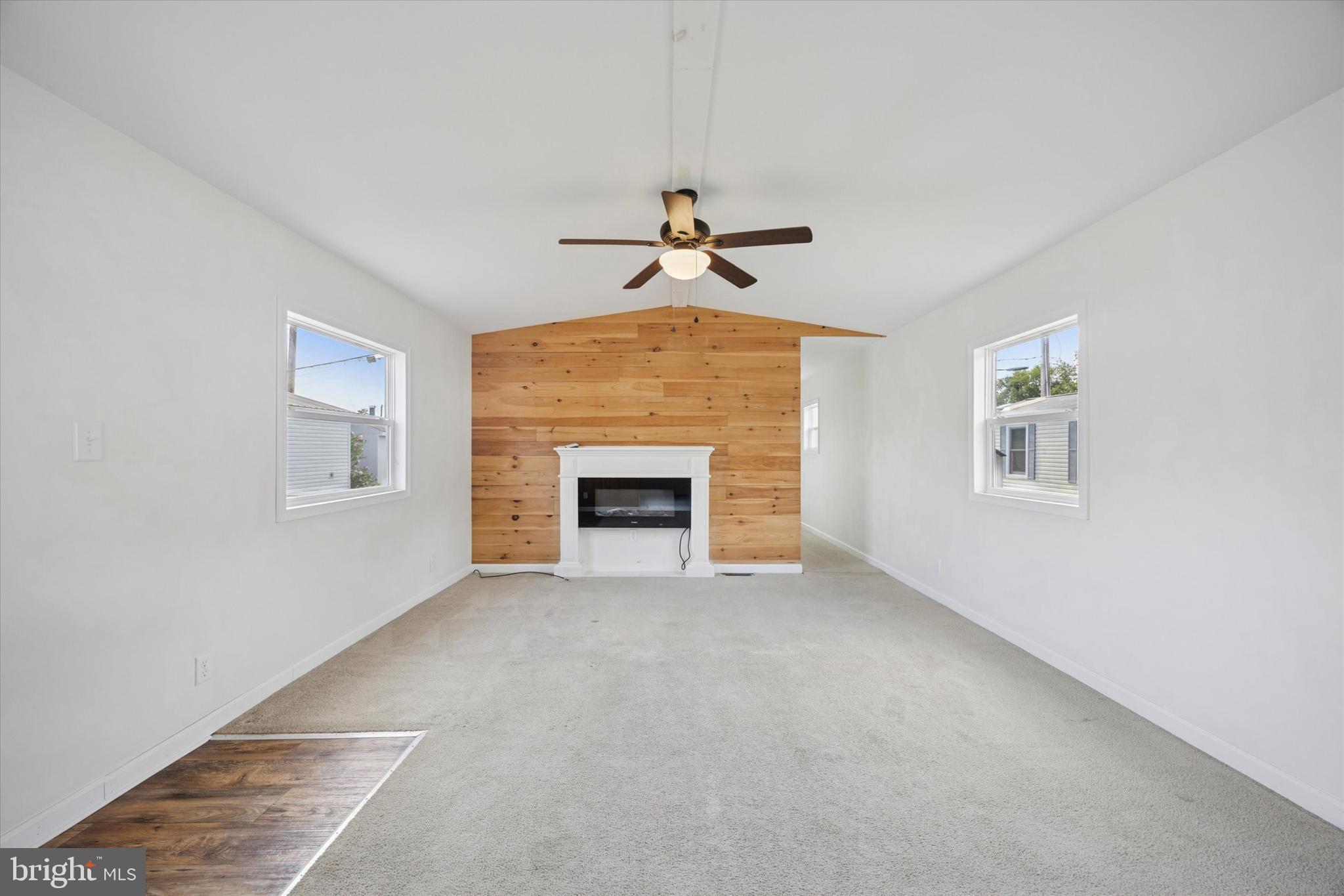 326 Delta Road Wilmington, DE 19810 - Photo 8 of 17 a view of an empty room with a ceiling fan and window