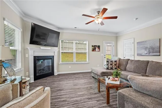 a living room with furniture fireplace and a flat screen tv