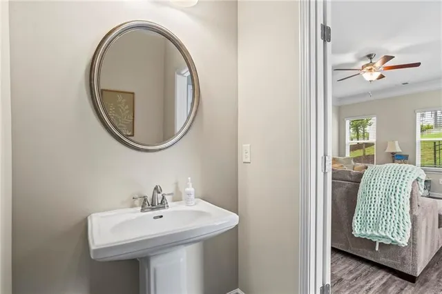 a bathroom with a sink a mirror and a toilet