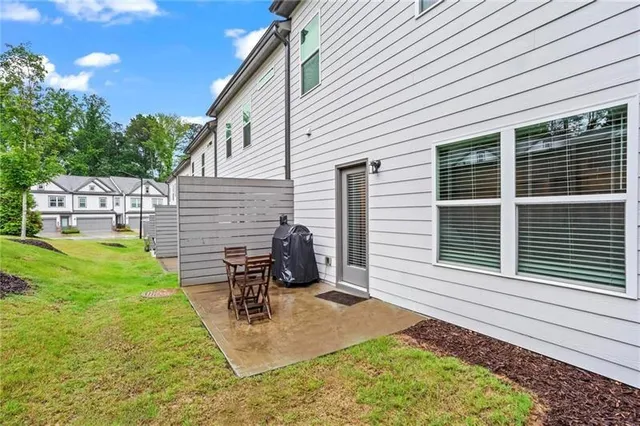 a view of a backyard with sitting area