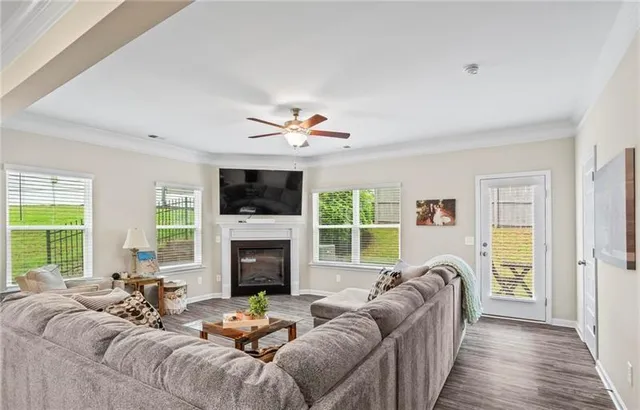 a living room with furniture fireplace and a flat screen tv