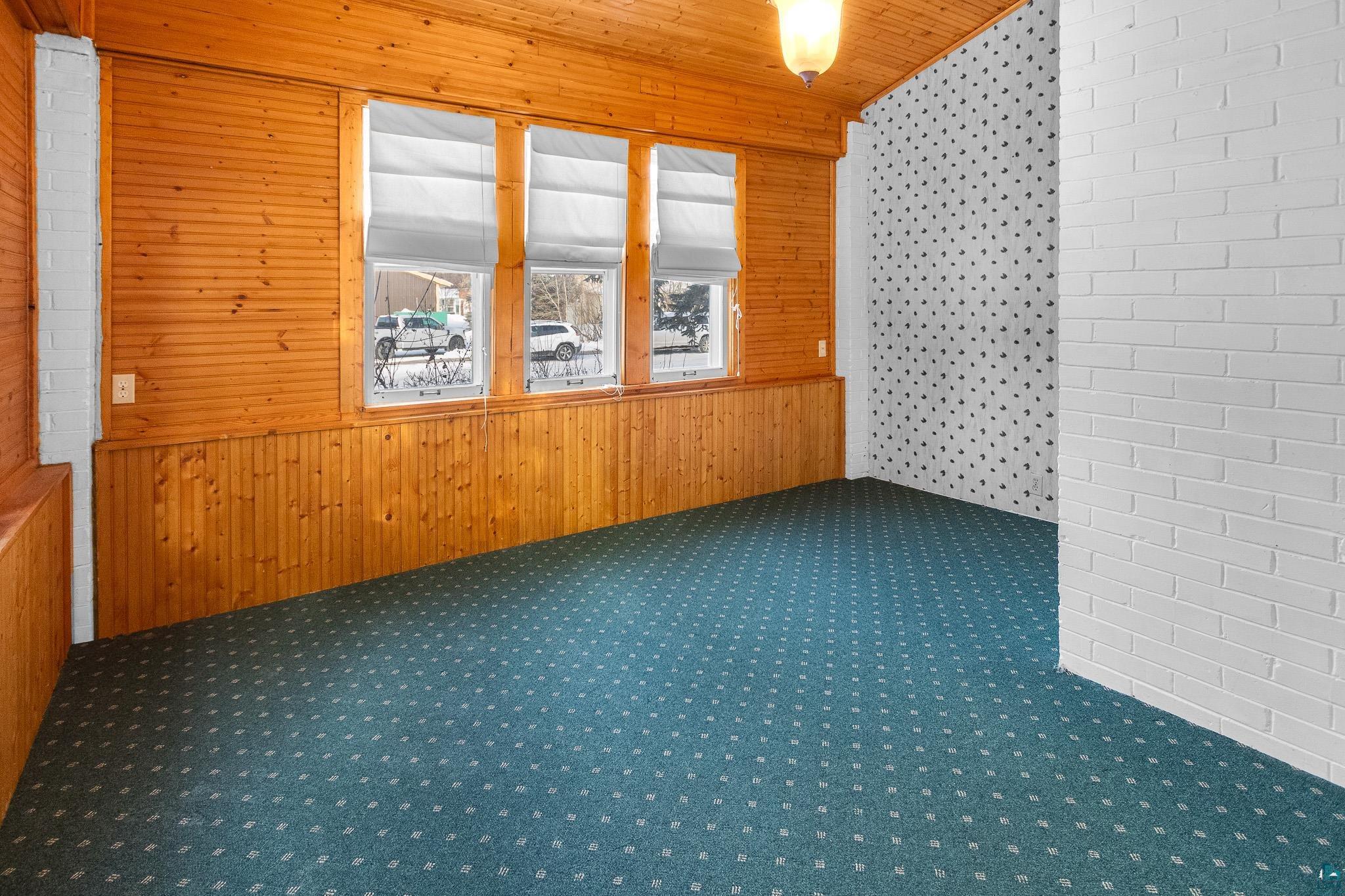 6494 School Street Finlayson, MN 55735 - Photo 20 of 31 Spare room featuring wooden walls