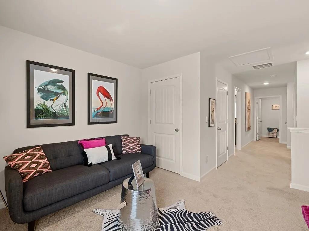 215 Oak Leaf Road Dallas, GA 30132 - Photo 7 of 12 a living room with furniture and a rug