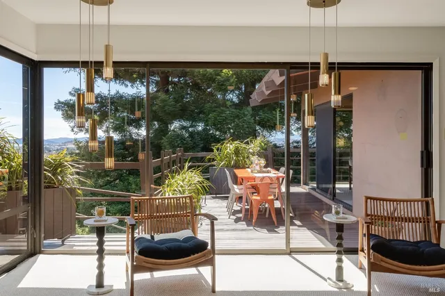 a dining room with furniture and wooden floor