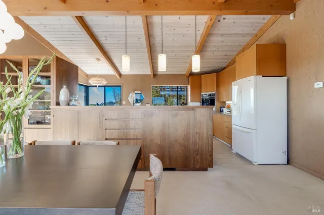 a bed room with a bed and a large window