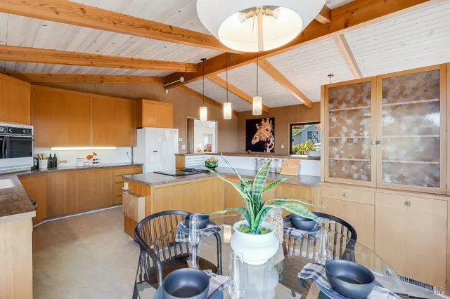 a bedroom with a large bed and a dresser