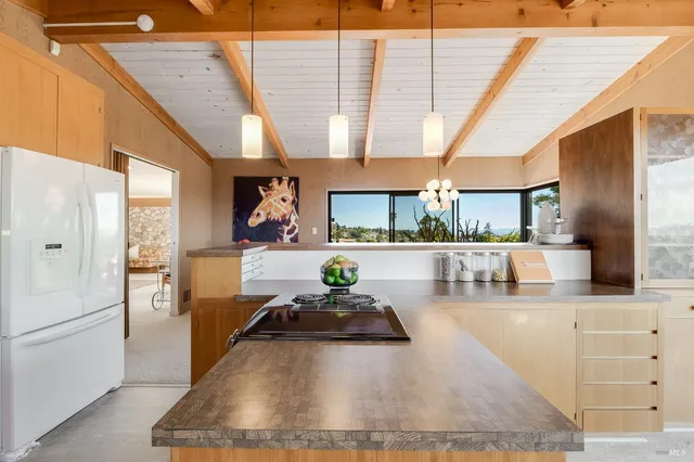 a bedroom with a large bed and a large window