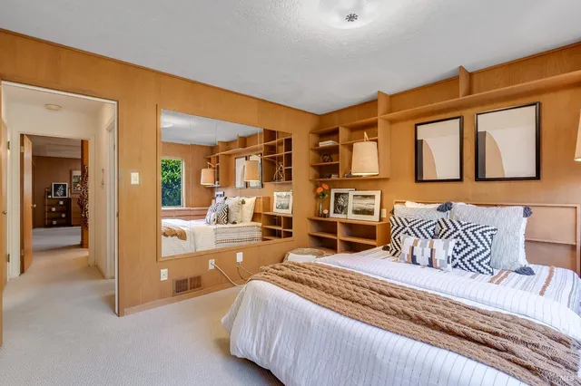 a dining room with furniture and wooden floor