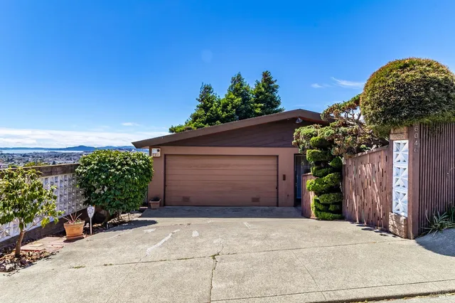 a view of a chair and tables in the garden