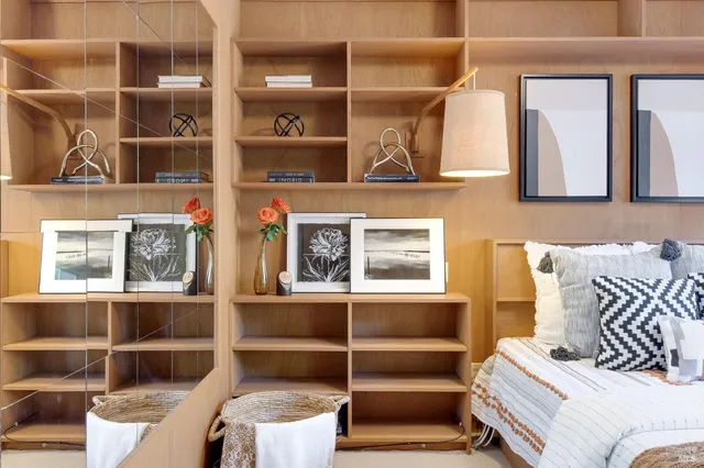 a view of a patio with a dining table and chairs with wooden floor