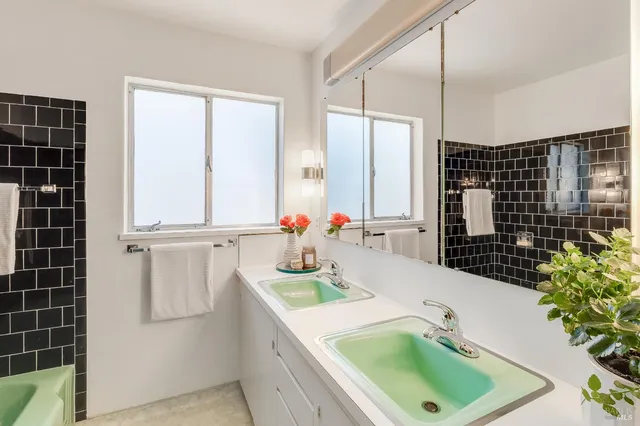a kitchen with a sink and a refrigerator