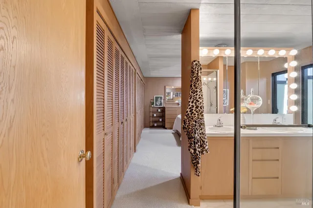 a bathroom with a sink a mirror and a shower