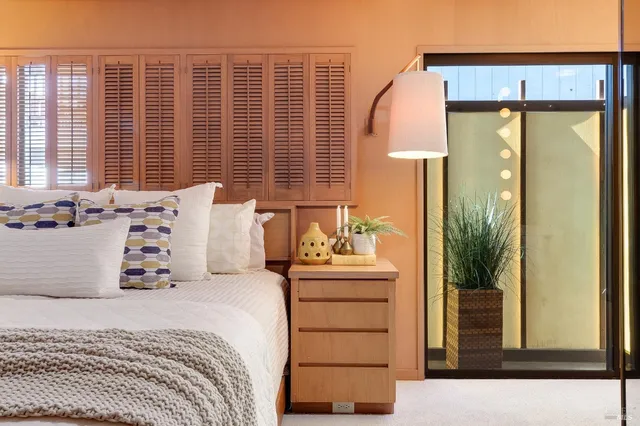 a bedroom with a bed and window