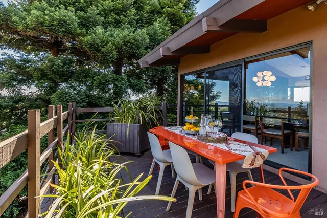 a outdoor living space with furniture and a potted plant