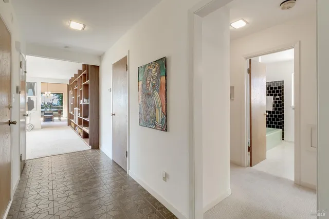 a living room with furniture a rug and a fireplace