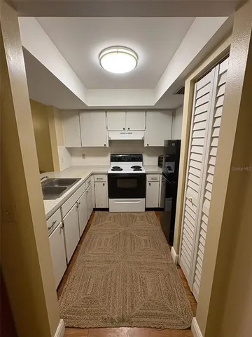 a view of an empty room and fire place