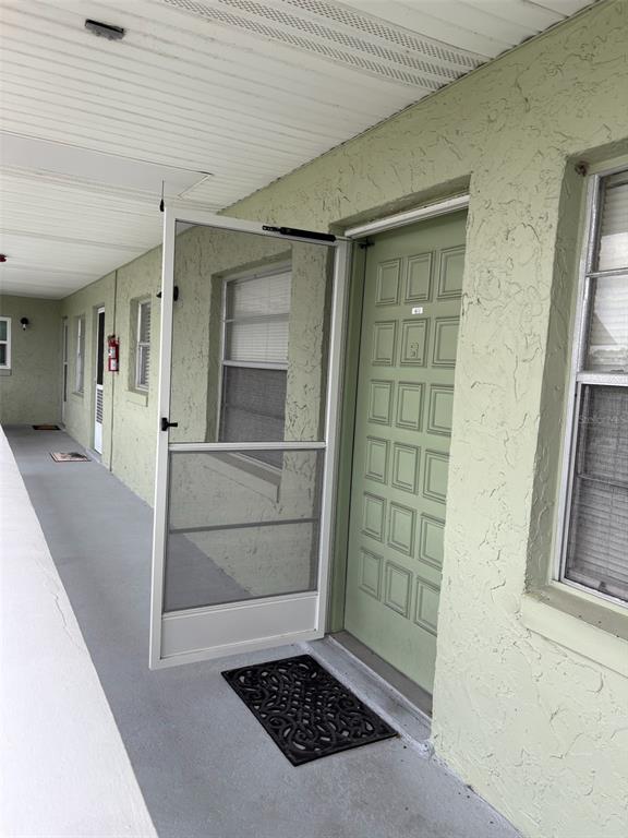 1250 South Pinellas Avenue, Unit 411 Tarpon Springs, FL 34689 - Photo 17 of 29 a view of an empty room and fire place