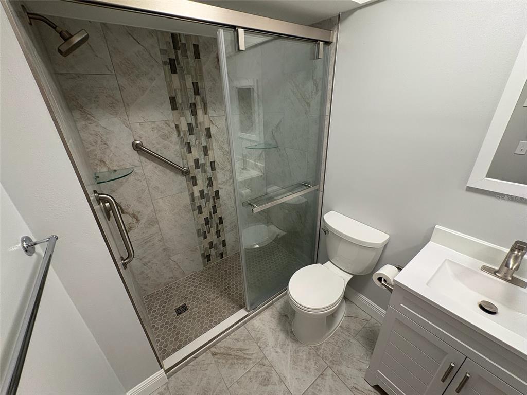 1250 South Pinellas Avenue, Unit 411 Tarpon Springs, FL 34689 - Photo 27 of 29 a bathroom with a shower and a toilet