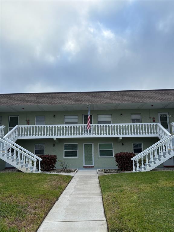 1250 South Pinellas Avenue, Unit 411 Tarpon Springs, FL 34689 - Photo 3 of 29 a view of a deck with a big yard and potted plants