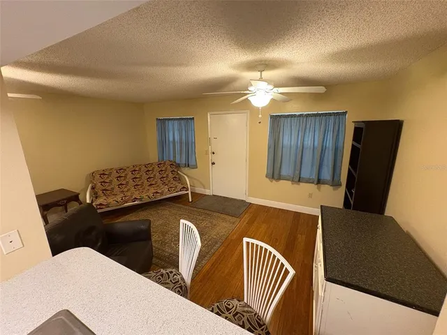 a balcony with chairs and a table