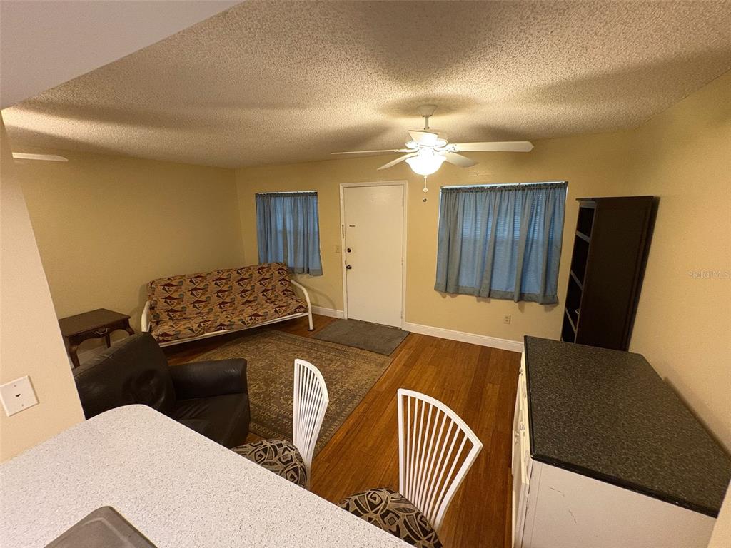 1250 South Pinellas Avenue, Unit 411 Tarpon Springs, FL 34689 - Photo 6 of 29 a balcony with chairs and a table