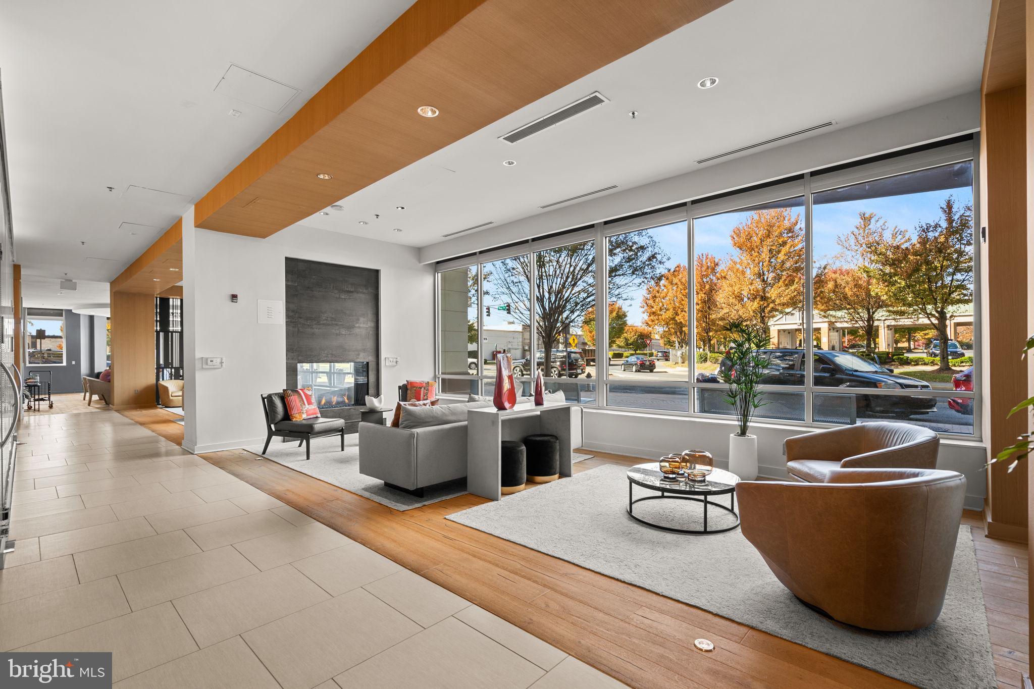 5750 Bou Avenue, Unit 1106 North Bethesda, MD 20852 - Photo 19 of 54 a living room with furniture and a large window