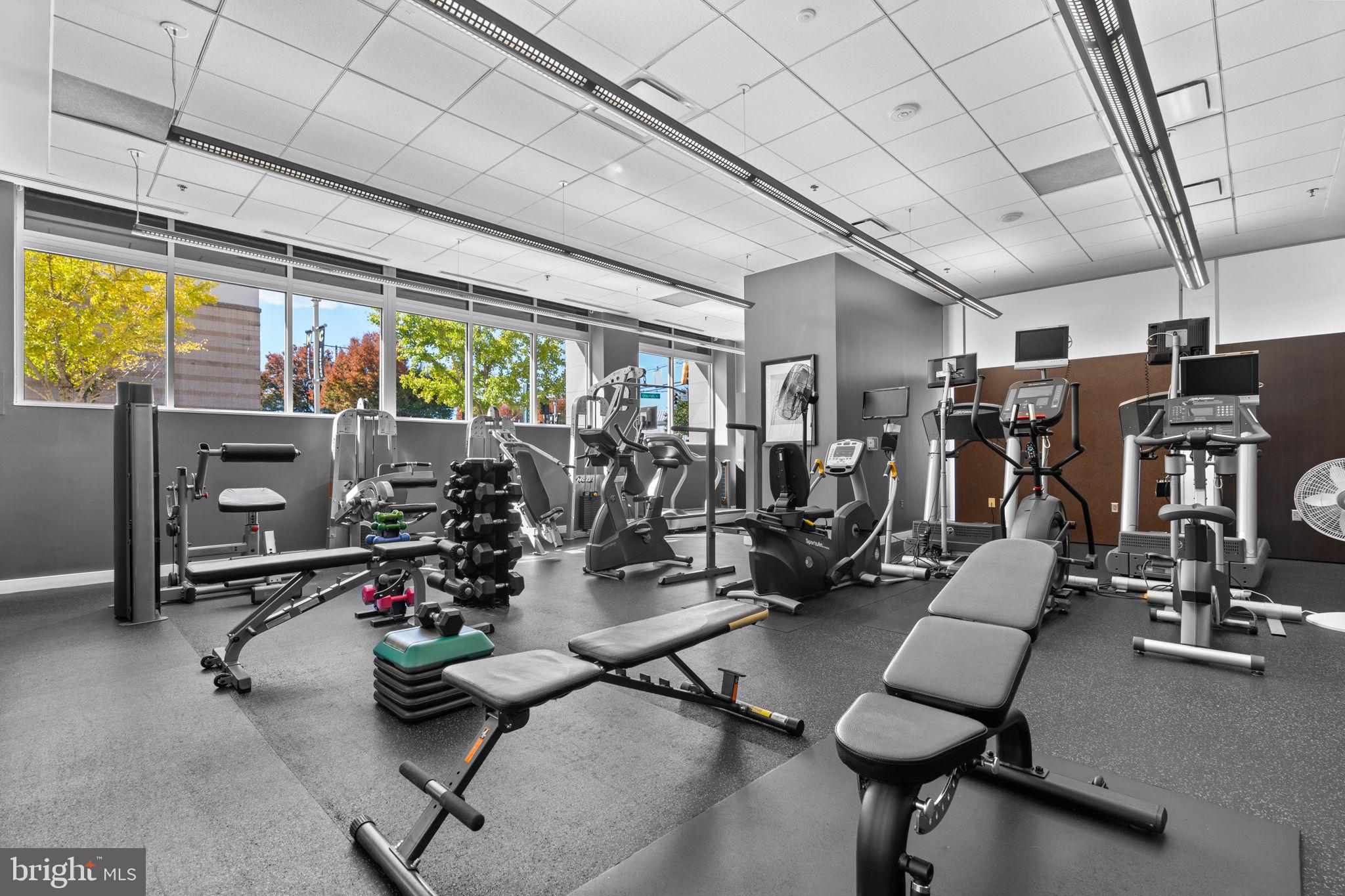 5750 Bou Avenue, Unit 1106 North Bethesda, MD 20852 - Photo 23 of 54 a room with gym equipment and a large window