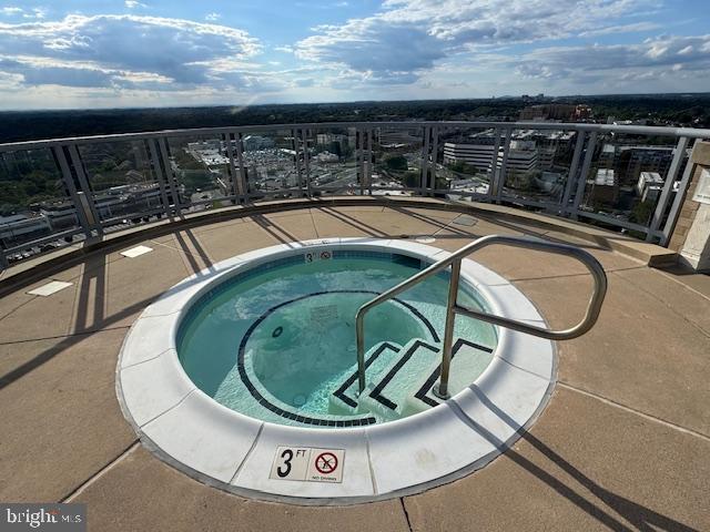 5750 Bou Avenue, Unit 1106 North Bethesda, MD 20852 - Photo 31 of 54 a view of a swimming pool with furniture