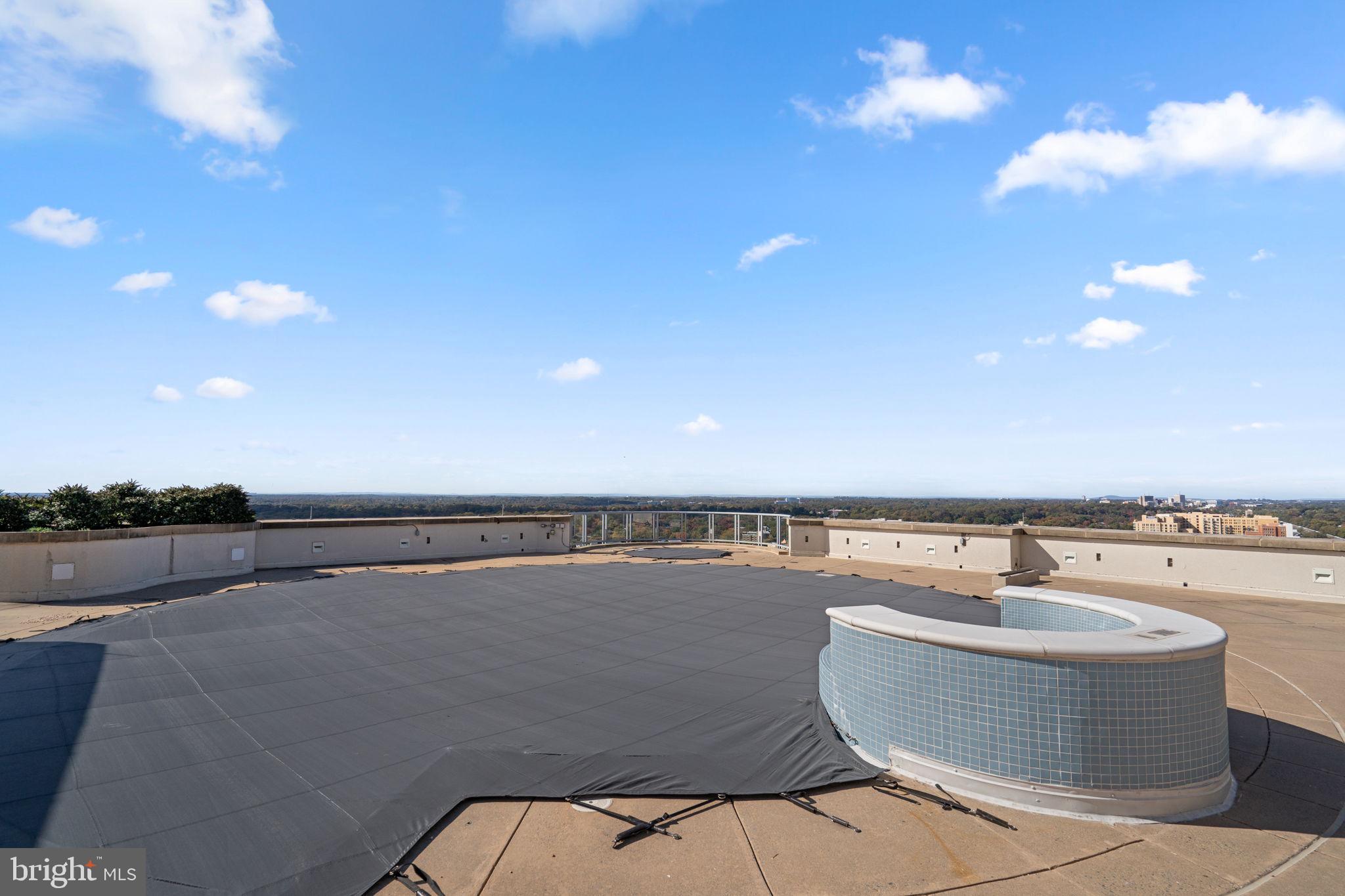 5750 Bou Avenue, Unit 1106 North Bethesda, MD 20852 - Photo 33 of 54 a view of swimming pool with outdoor seating and yard in back