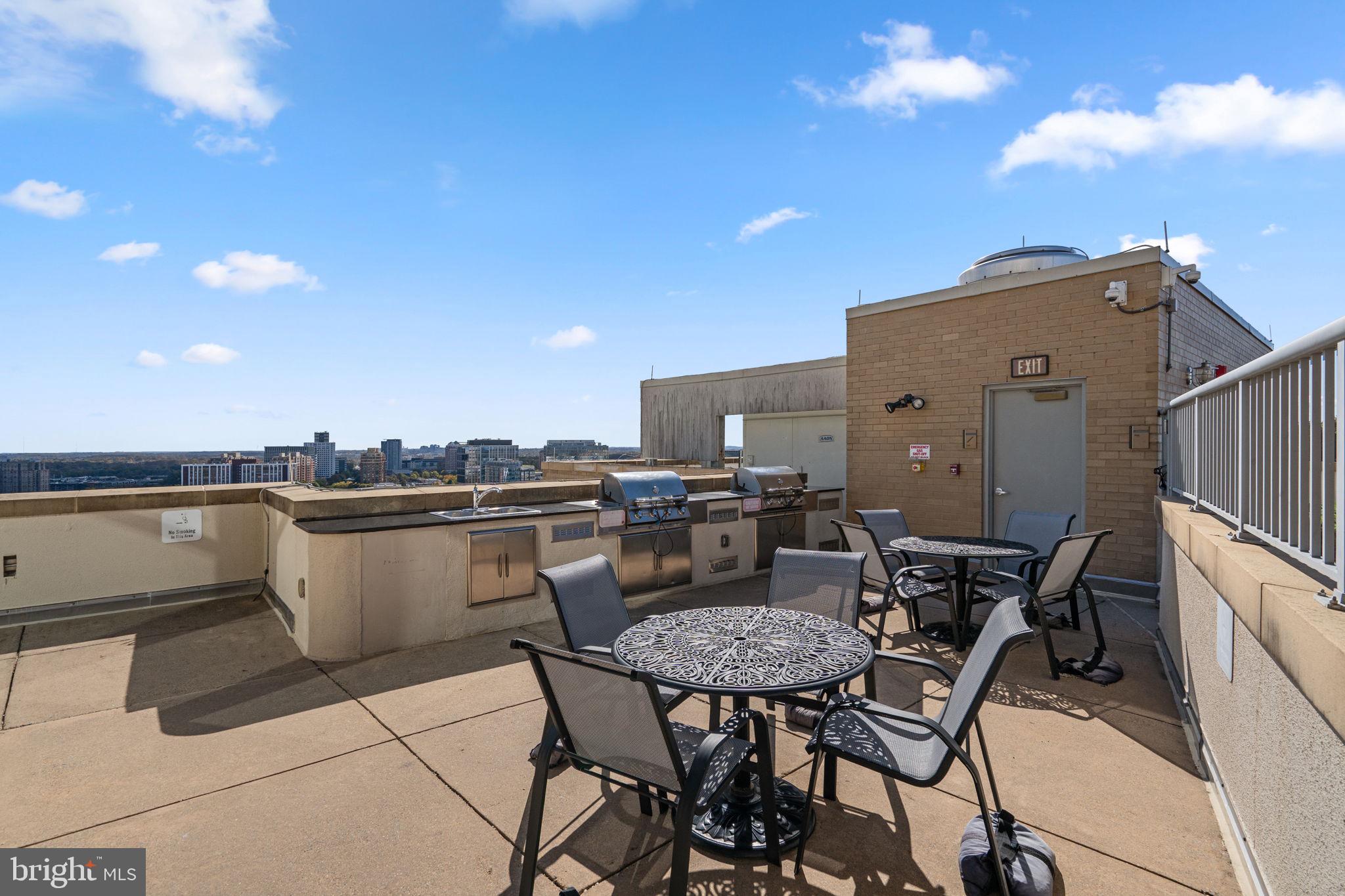5750 Bou Avenue, Unit 1106 North Bethesda, MD 20852 - Photo 34 of 54 a view of a terrace with furniture and stove