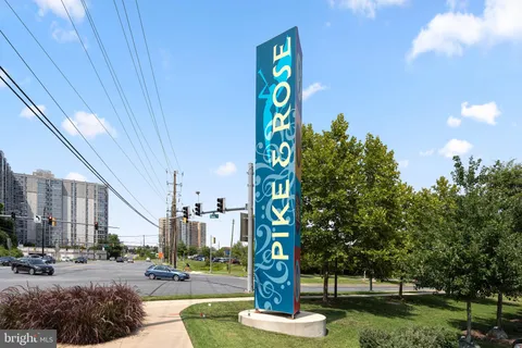 a view of a house with potted plants
