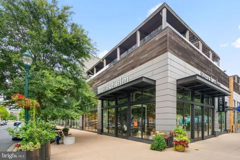 a front view of a building with garden