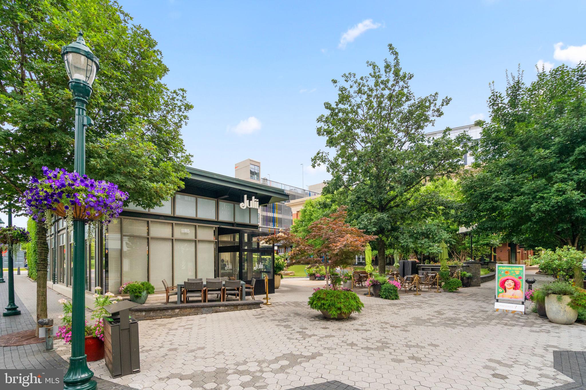 5750 Bou Avenue, Unit 1106 North Bethesda, MD 20852 - Photo 39 of 54 a front view of a house with a tree
