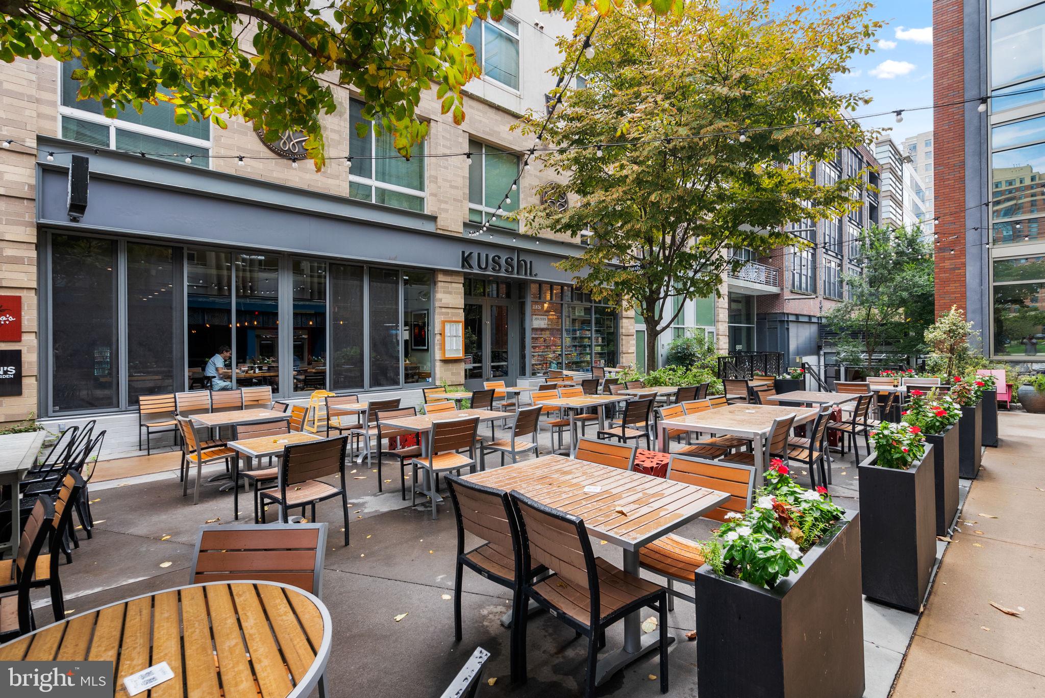 5750 Bou Avenue, Unit 1106 North Bethesda, MD 20852 - Photo 46 of 54 a view of a patio with couches table and chairs and potted plants