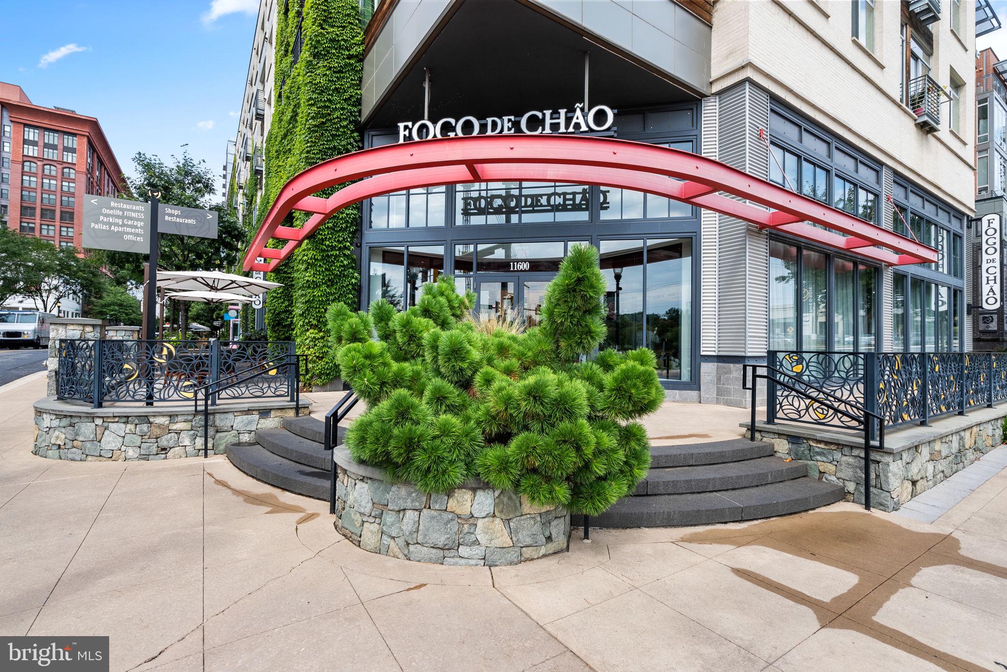5750 Bou Avenue, Unit 1106 North Bethesda, MD 20852 - Photo 48 of 54 a front view of multi story residential apartment building with yard
