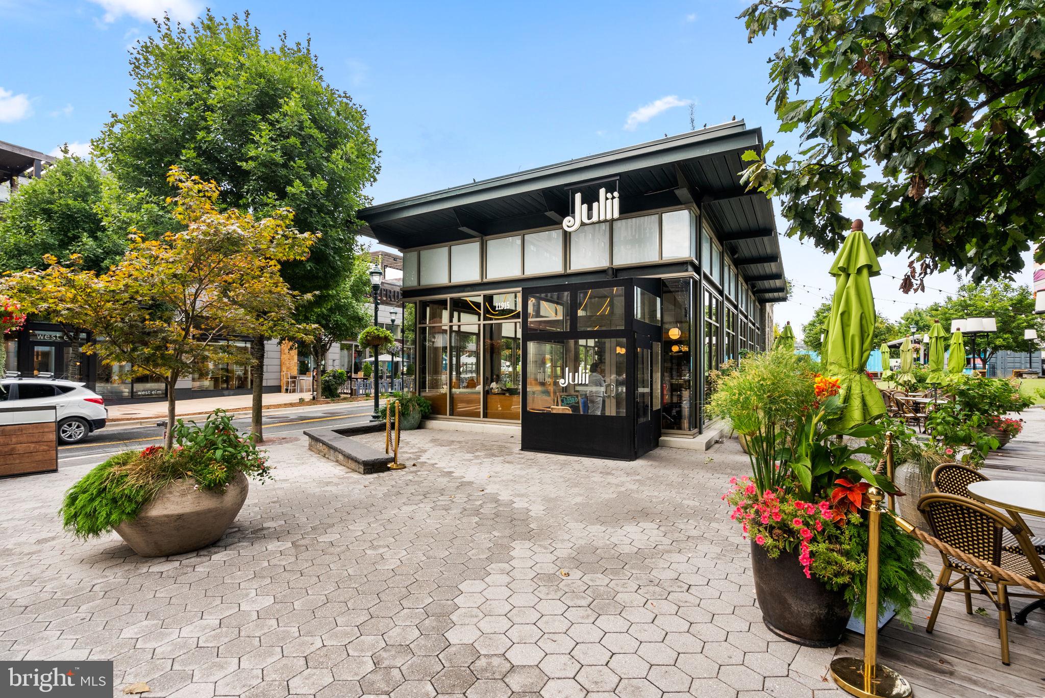 5750 Bou Avenue, Unit 1106 North Bethesda, MD 20852 - Photo 50 of 54 a view of a chair and tables in the patio