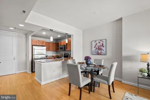 a view of a dining room with furniture and wooden floor