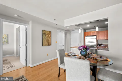 a view of a dining room with furniture and wooden floor