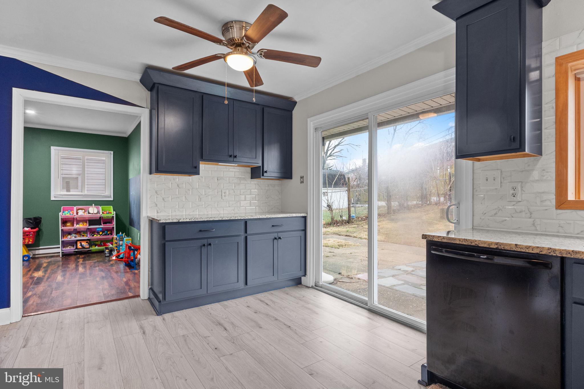 19 Violet Road Levittown, PA 19057 - Photo 11 of 26 a kitchen with kitchen island a counter top space appliances and a sink