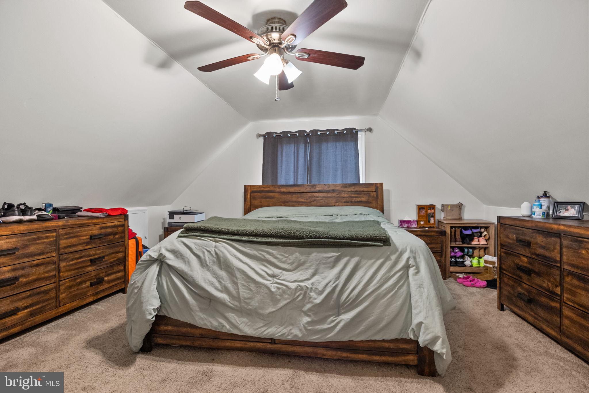 19 Violet Road Levittown, PA 19057 - Photo 19 of 26 a bedroom with a bed and a chandelier