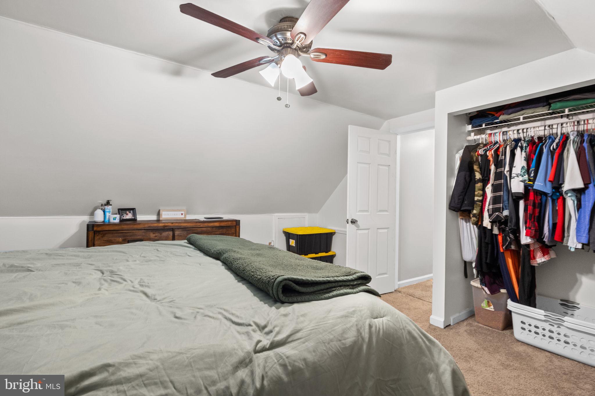 19 Violet Road Levittown, PA 19057 - Photo 20 of 26 a bedroom with a bed and a walk in closet